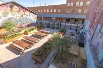 European-style courtyard with chicken coop and herb garden