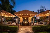 Two outdoor courtyards with fire pits