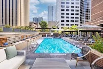Outdoor pool with multiple seating areas