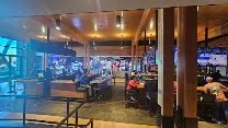 Massive venue with bowling, arcade, and large TVs