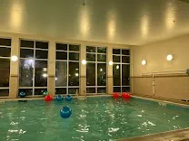 Indoor pool, gym, and lobby bar