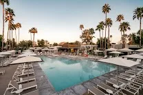 Large pool with ample seating and fire pits
