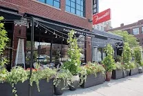 Covered outdoor terrace with seating