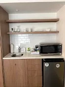 Kitchenettes with full plateware and appliances