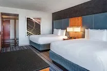 Modern rooms with runway views and high-tech features