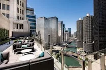 Upscale rooftop bar with river vistas