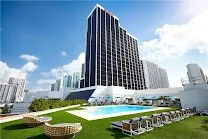 Rooftop pool with skyline and bay views