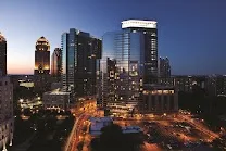 Sleek 26-story glass tower with floor-to-ceiling windows