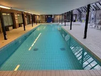 Heated indoor pool with adjacent spa and fitness center