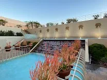 Peaceful courtyard with waterfall and mid-way terrace