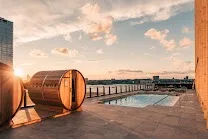 Outdoor pool and terrace with skyline and river views