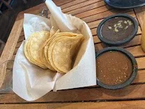 Outdoor seating with live music and handcrafted cocktails