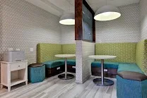 Airy lounge combining work and dining spaces