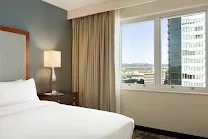 Spacious all-suite rooms with city and mountain views
