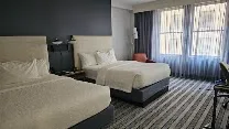 Quiet rooms with comfortable beds and ample storage