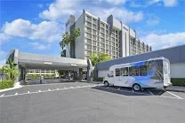 Directly across from the airport with free shuttle service