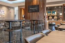 All-suite rooms with workspace and kitchen conveniences