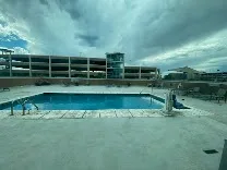 Outdoor pool and gym on-site