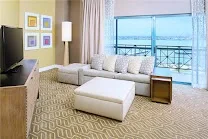 Modern all-suite hotel rooms with balcony views