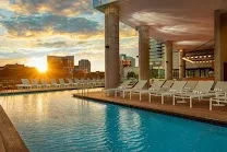 Outdoor pool and gym in an upscale setting