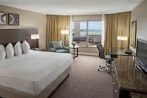 Chic rooms with floor-to-ceiling windows and city views