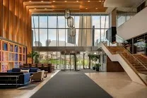 Modern design with soaring ceilings and warm lighting