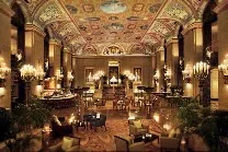 Lavish lobby with ornate ceiling and grand décor