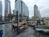 Vibrant rooftop bar with games and happy hour