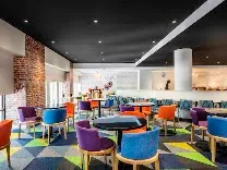 Restaurant, bar, and fitness center in a modern setting
