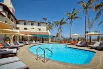 Outdoor pool with bar and direct beach access