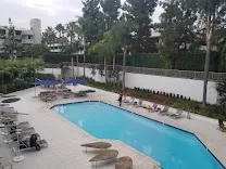 Indoor and outdoor pools with a large outdoor screen