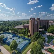 Two pools and tennis courts on a lakeside setting